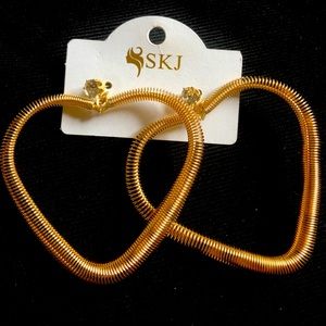 Gold tone large heart shape metal dangle earrings